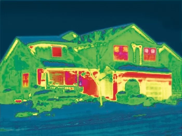 The red areas indicate heat loss at the window.